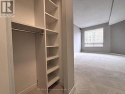... His & Hers closets with organizers -