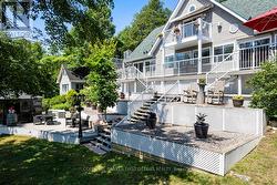 Home's expansive decks & balconies overlook lake -