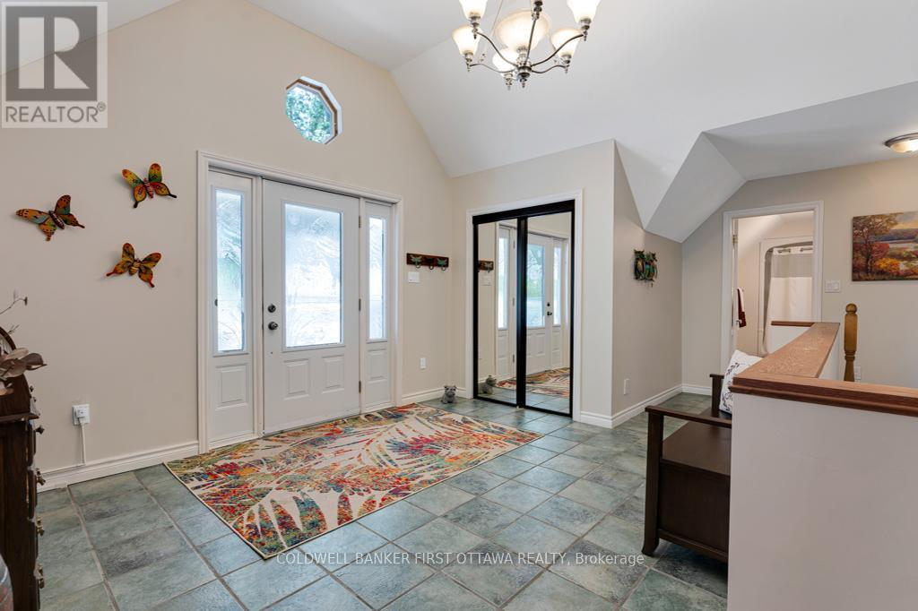 Vaulted foyer entry with closet & ceramic floor - 320 Pike Lake Route 12 Road, Tay Valley, ON - Indoor Photo Showing Other Room