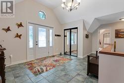 Vaulted foyer entry with closet & ceramic floor -