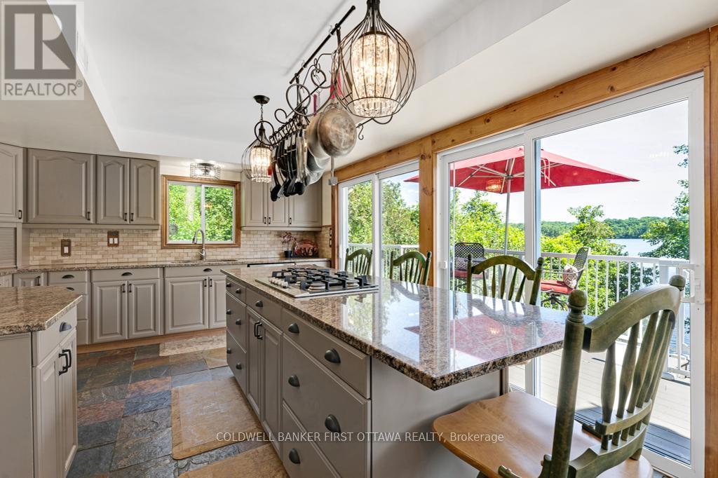 Gorgeous gourmet kitchen has panoramic lake views - 320 Pike Lake Route 12 Road, Tay Valley, ON - Indoor