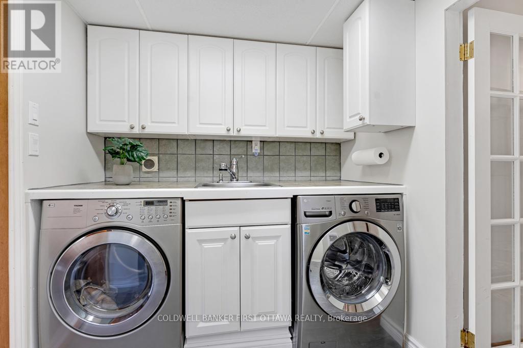 Laundryroom walls of storage & pullout drying rack - 320 Pike Lake Route 12 Road, Tay Valley, ON - Indoor Photo Showing Laundry Room