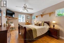 Main level bedroom has laminate plank flooring -