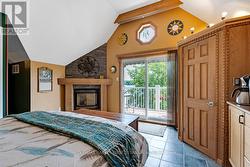 Upper level primary bedroom with propane fireplace -