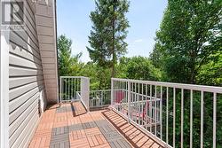 Upper level 2nd bedrm's private two-tiered balcony -