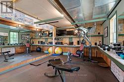 Three-car garage also has gym and workout area -