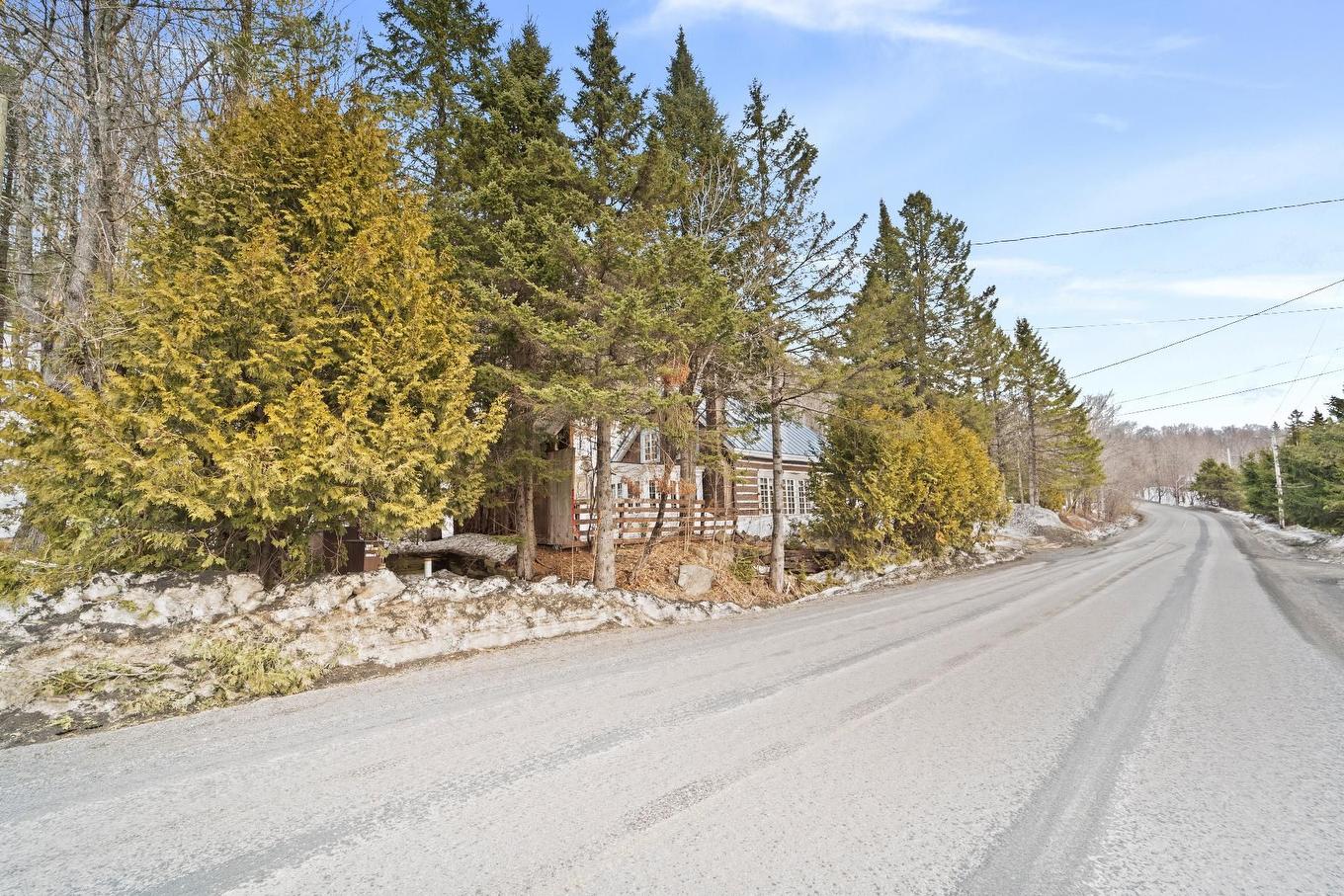 Façade - 1595 Ch. Du Lac-Des-Becs-Scie O., Saint-Sauveur, QC - Outdoor With View