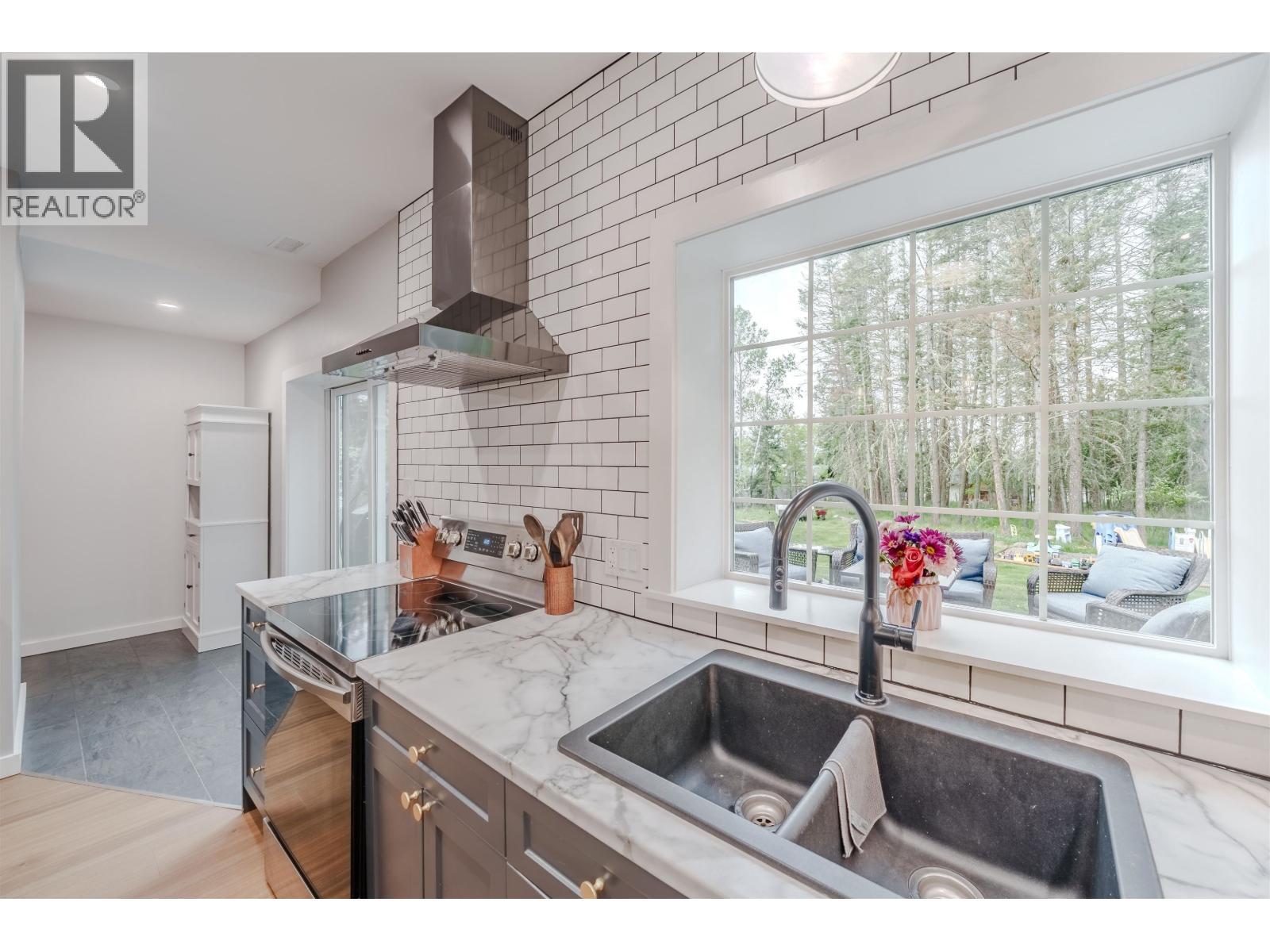 4908 Kitwanga Drive, 108 Mile Ranch, BC - Indoor Photo Showing Kitchen With Double Sink