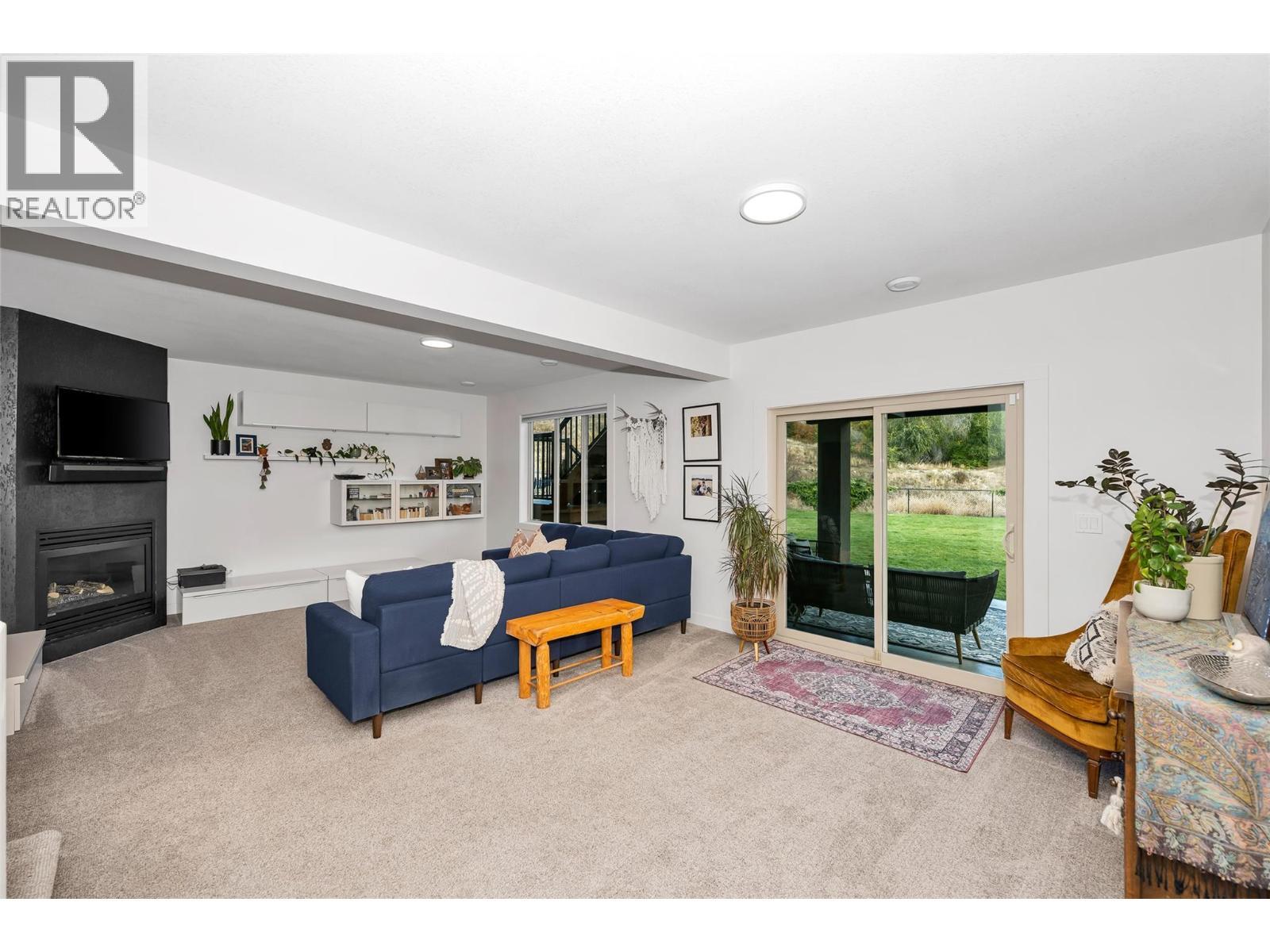 221 Kicking Horse Place, Vernon, BC - Indoor Photo Showing Living Room With Fireplace