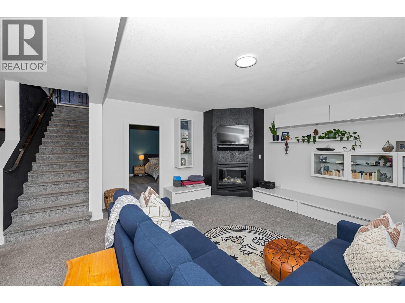 221 Kicking Horse Place, Vernon, BC - Indoor Photo Showing Living Room With Fireplace