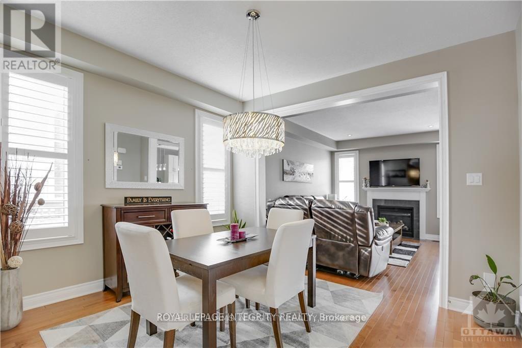 307 Meadowbreeze Drive, Ottawa, ON - Indoor Photo Showing Dining Room With Fireplace