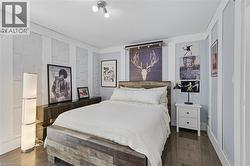 Bedroom featuring dark wood-type flooring -
