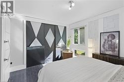 Bedroom featuring wood finished floors -