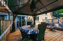 Wooden terrace with outdoor dining space -