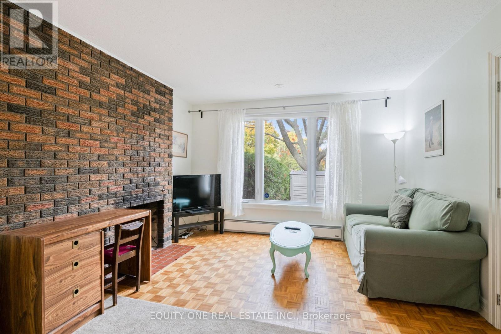 73 Hobart Crescent, Ottawa, ON - Indoor Photo Showing Living Room With Fireplace