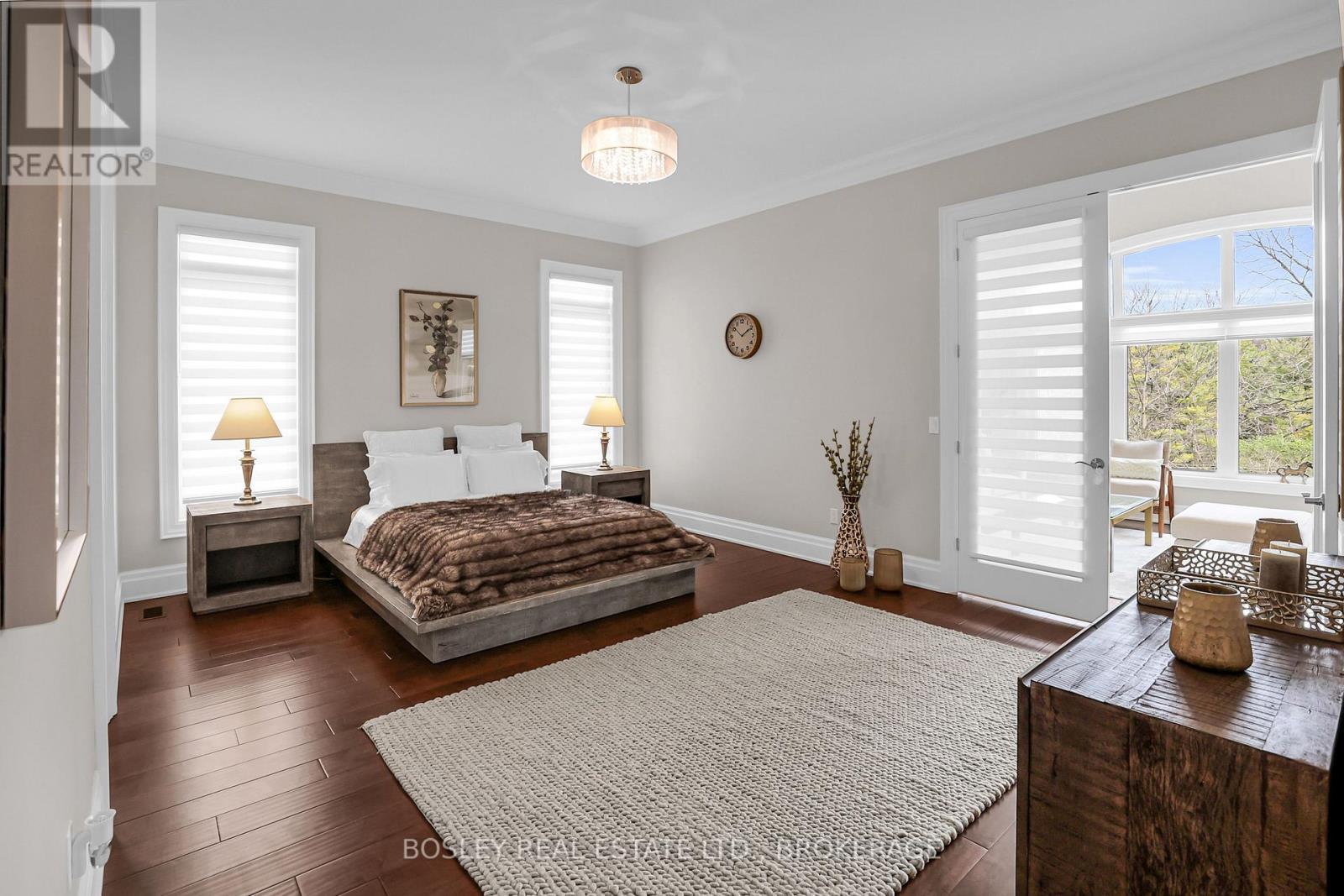 Primary bedroom with entrance to the lounge - 32 Philmori Boulevard, Pelham (Fonthill), ON - Indoor Photo Showing Bedroom