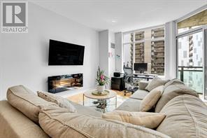 701 - 570 Laurier Avenue W, Ottawa, ON - Indoor Photo Showing Living Room With Fireplace