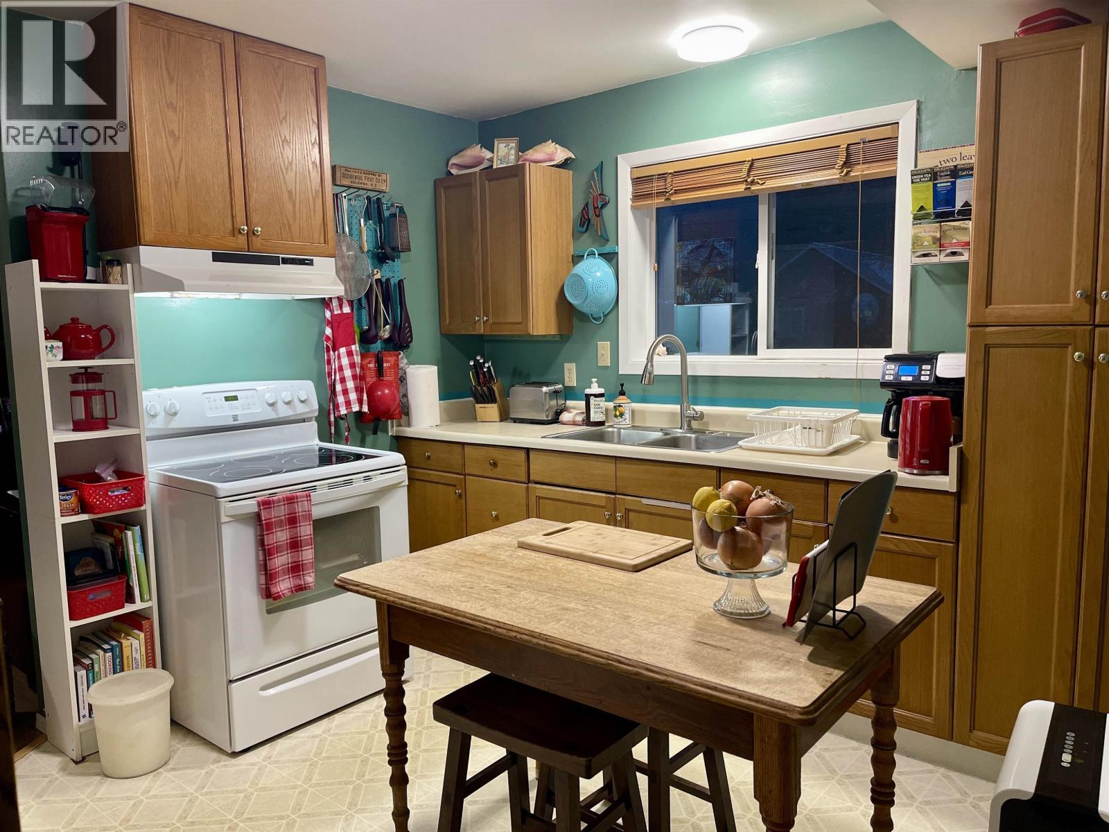 259 20 Mackenzie Highway, Hagensborg, BC - Indoor Photo Showing Kitchen With Double Sink