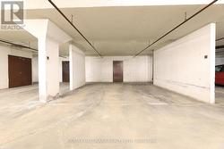Large parking spot with large locker behind -