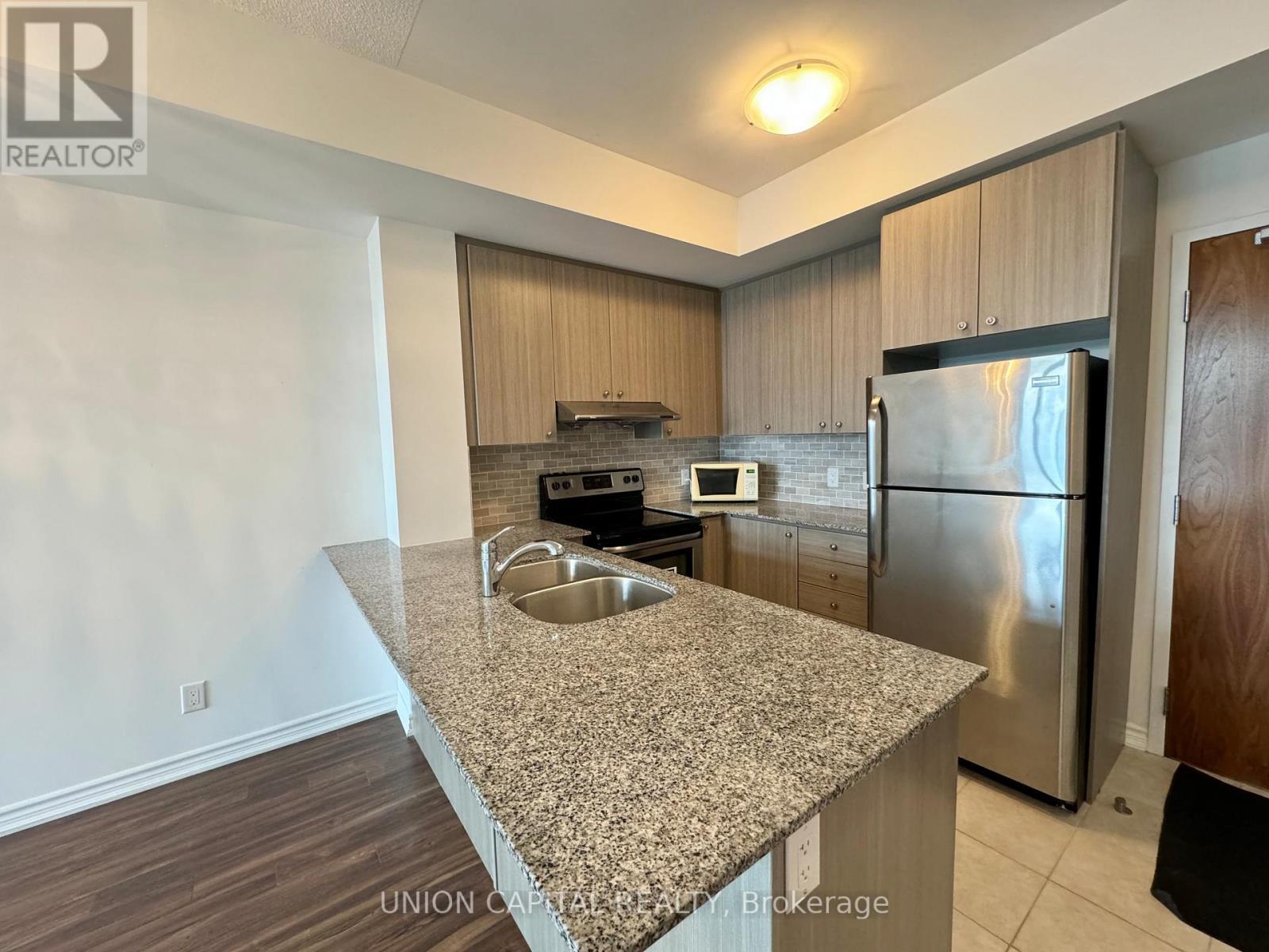 217 - 8323 Kennedy Road, Markham, ON - Indoor Photo Showing Kitchen With Stainless Steel Kitchen With Double Sink