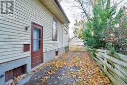 Single driveway; side door entrance to the home. -