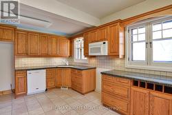 Eat-in kitchen; oak cabinets & granite countertop. -
