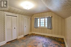 Primary bedroom with double clothes closet. -