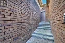 Garage access and alleyway between units. -