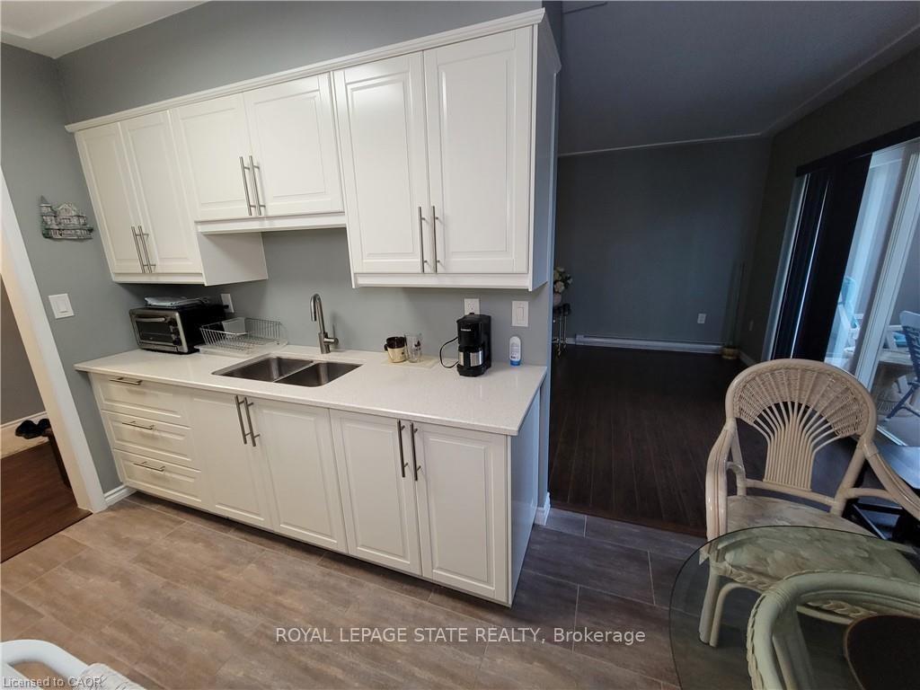 210-11 Woodman Drive S, Hamilton, ON - Indoor Photo Showing Kitchen With Double Sink