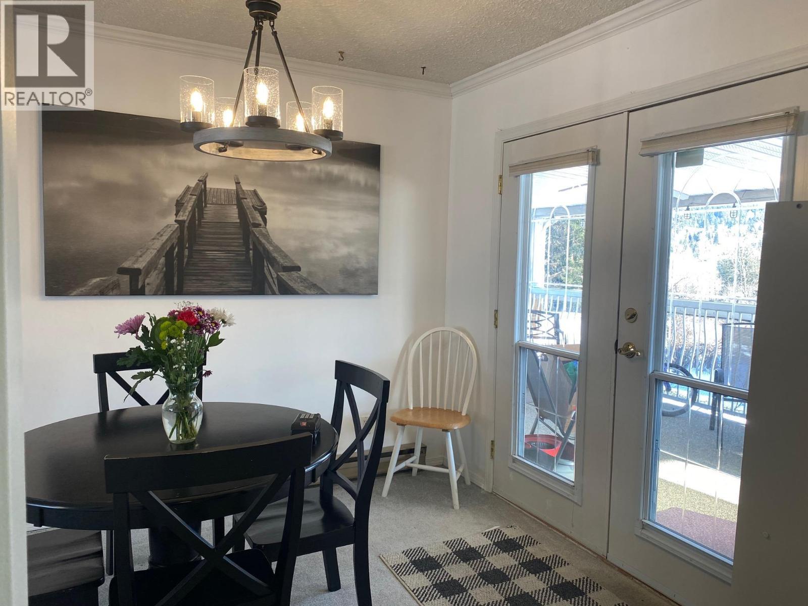 Easy access to your covered deck - 1768 First Street, Fruitvale, BC - Indoor Photo Showing Dining Room