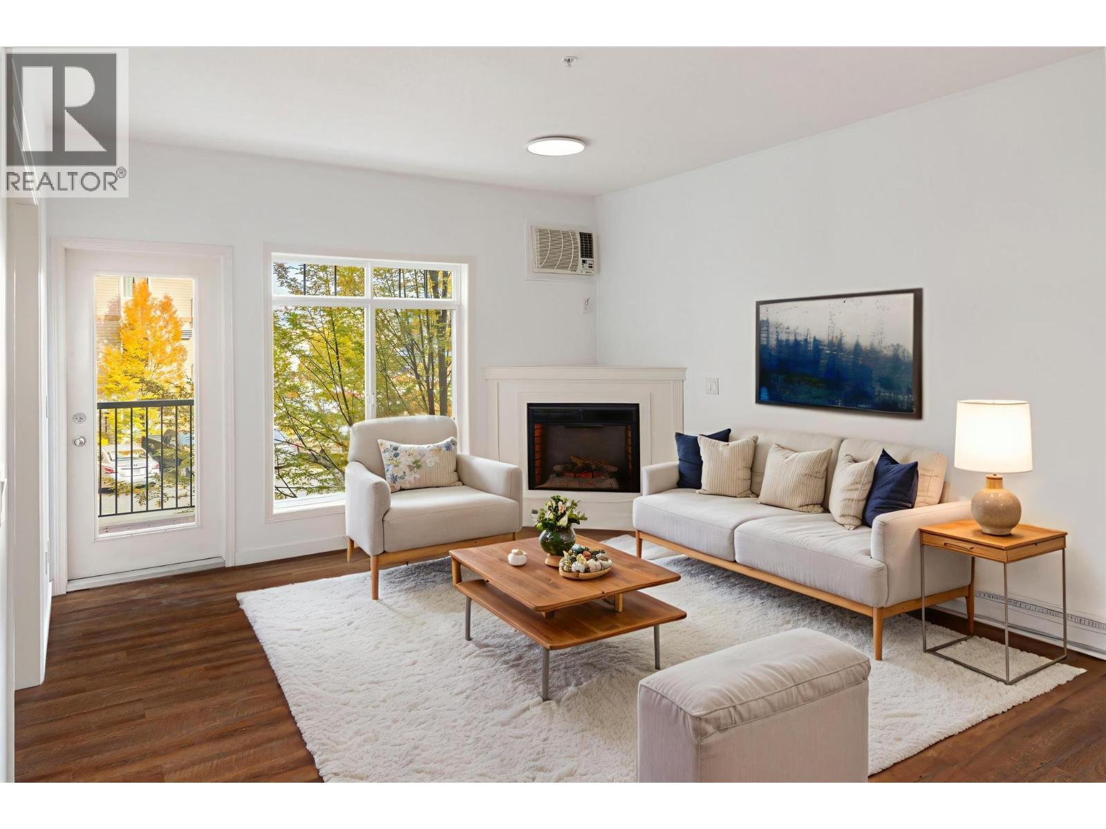 Virtually Staged - 250 Hollywood Road S Unit# 206, Kelowna, BC - Indoor Photo Showing Living Room With Fireplace