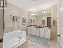 Ensuite bathroom w/ soaker tub -