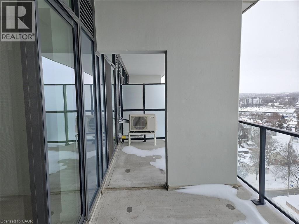 View of snow covered back of property - 741 King Street W Unit# 1207, Kitchener, ON - Outdoor With Balcony With Exterior