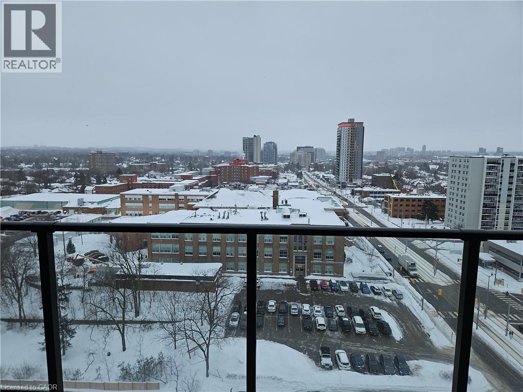 Snow covered back of property featuring a city view - 741 King Street W Unit# 1207, Kitchener, ON - Outdoor With Balcony With View