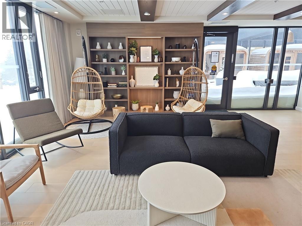 Living room featuring beamed ceiling - 741 King Street W Unit# 1207, Kitchener, ON - Indoor