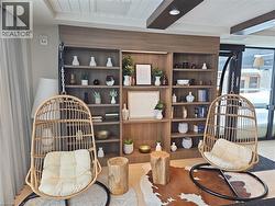 Living area featuring beamed ceiling -