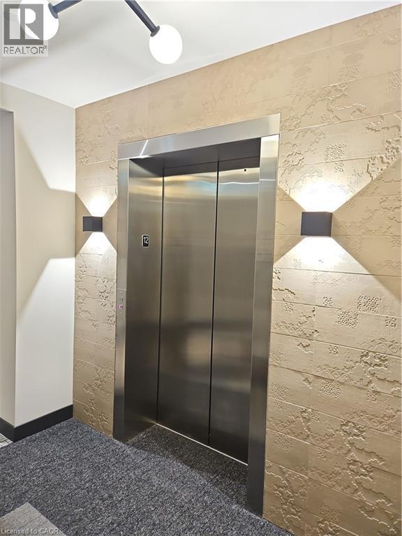 Details with elevator - 741 King Street W Unit# 1207, Kitchener, ON - Indoor Photo Showing Other Room