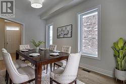 Den staged as formal dining -