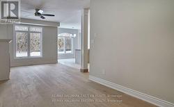 Den looking to living area and kitchen -