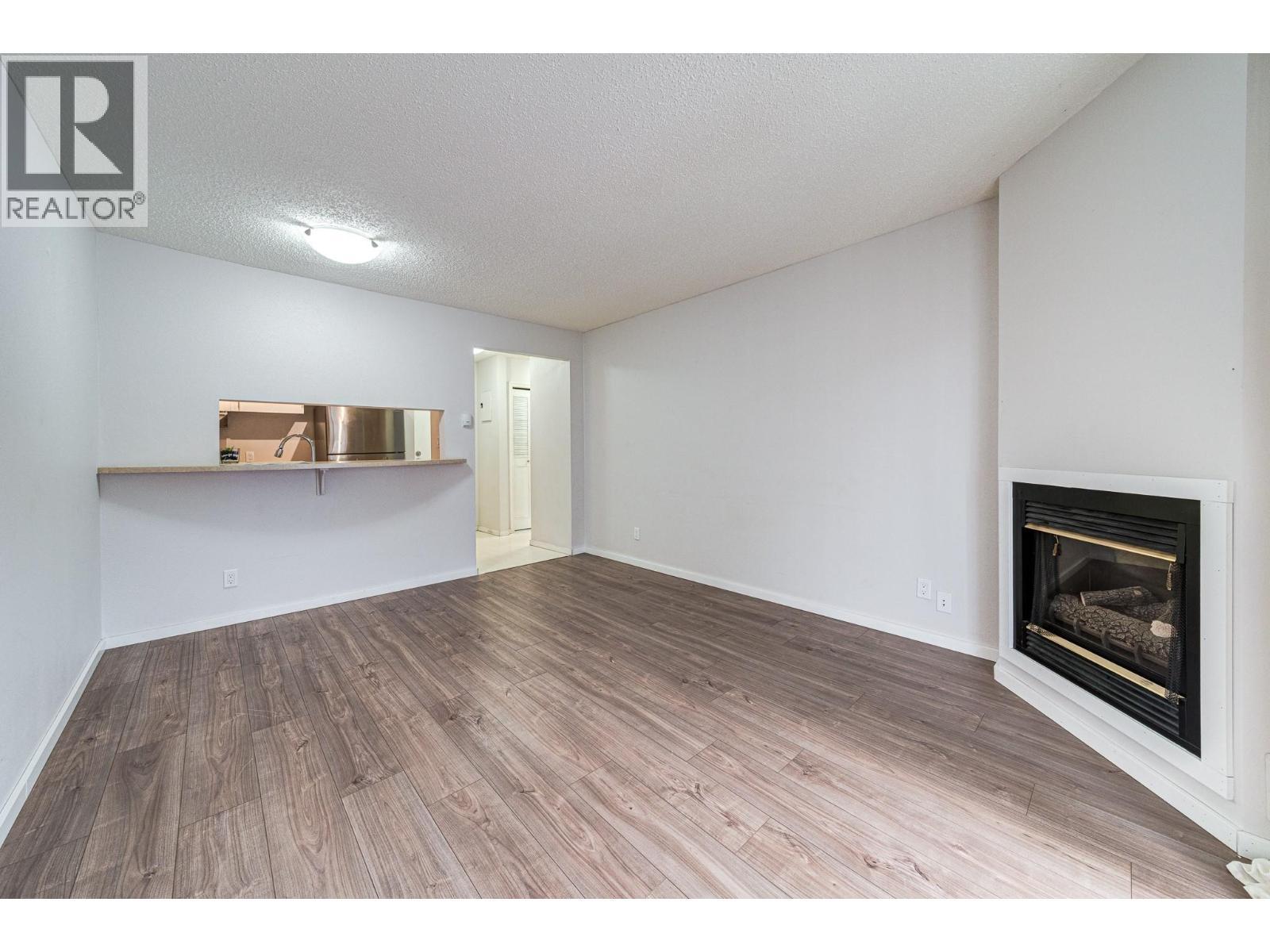 1802 Alpine Drive Unit# 306A, Elkford, BC - Indoor With Fireplace