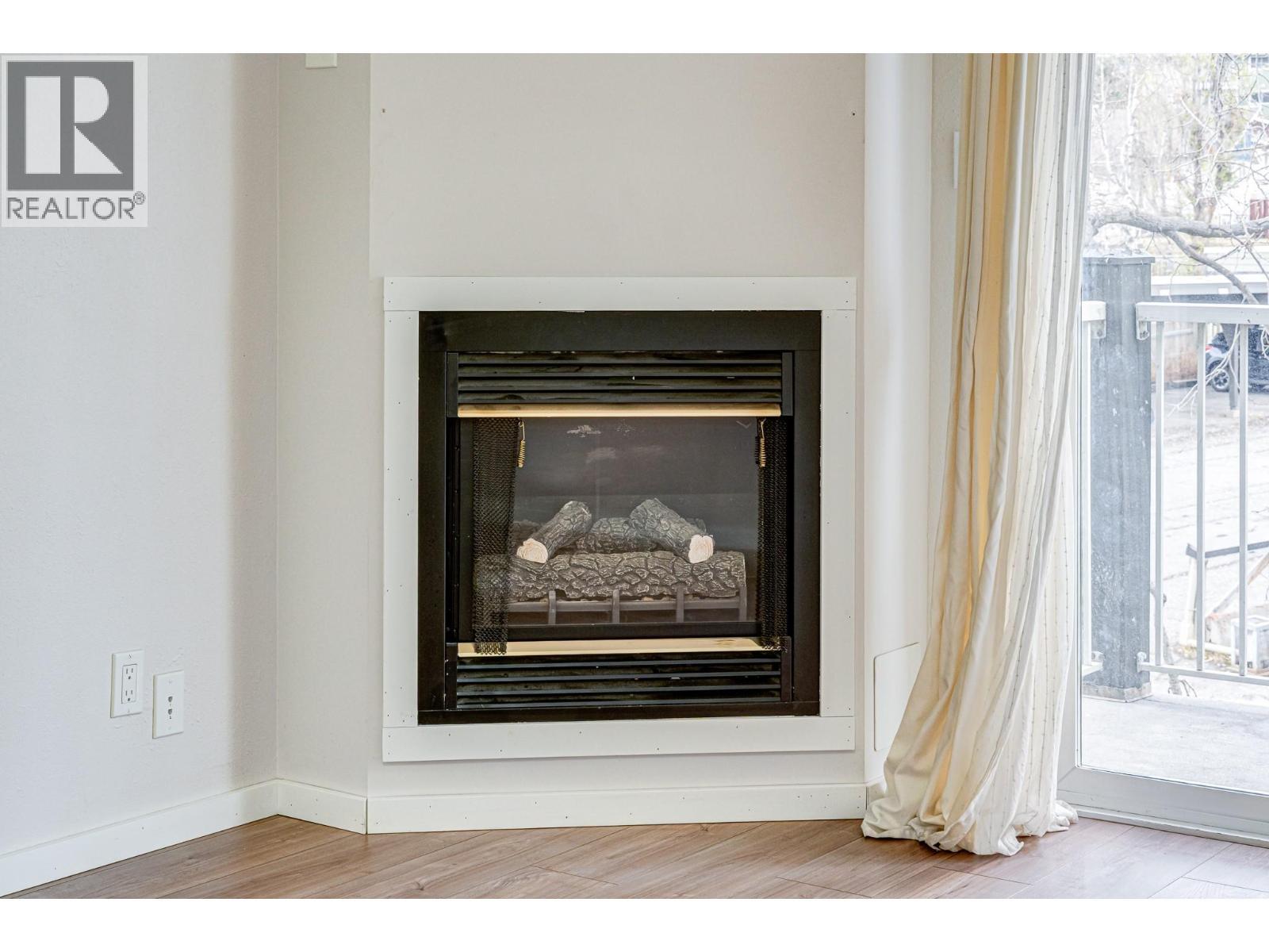 1802 Alpine Drive Unit# 306A, Elkford, BC - Indoor Photo Showing Living Room With Fireplace