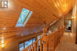 Cathedral pine ceiling & catwalk with pine railing -