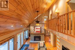 Cathedral pine ceiling & catwalk with pine railing -