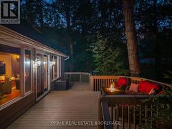 Enjoy a fire on the deck under a canopy of trees -