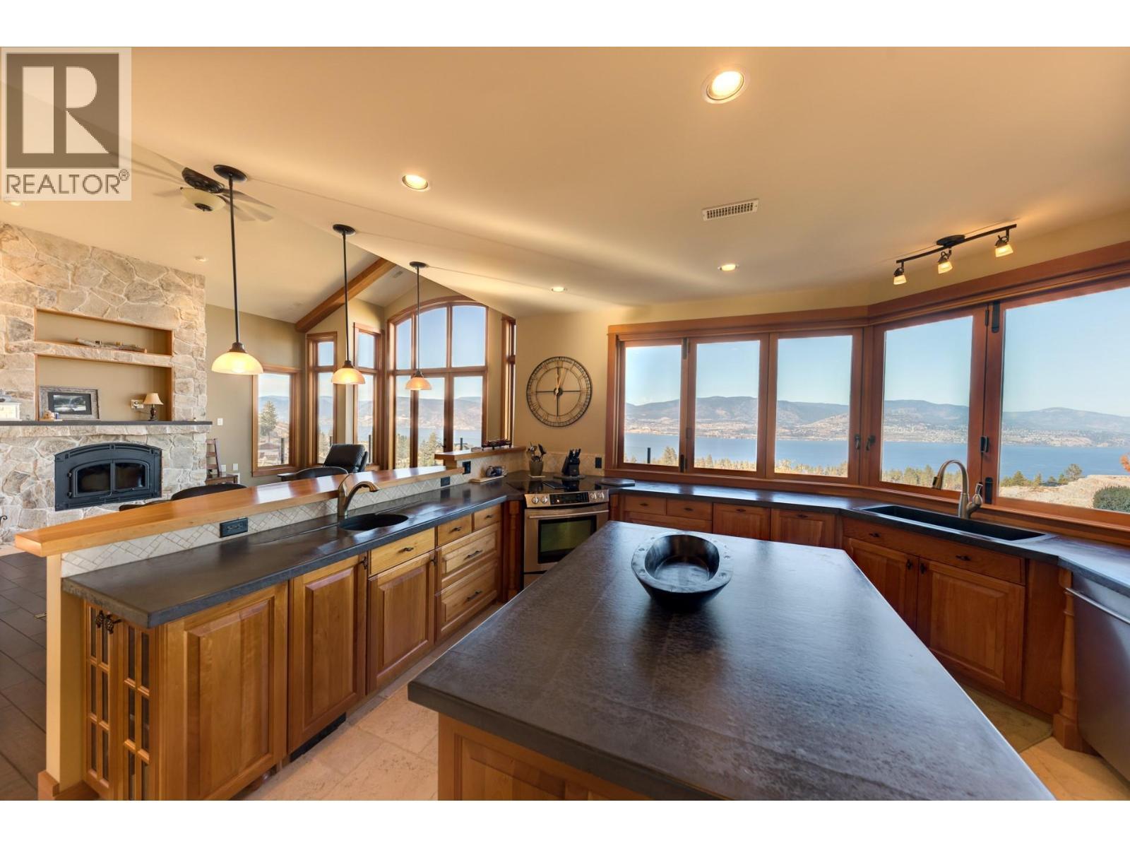 105 Timberline Road, Kelowna, BC - Indoor Photo Showing Kitchen With Fireplace
