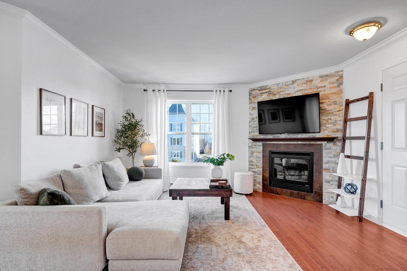 Living room - 5-1099 Boul. Maisonneuve, Saint-Jérôme, QC - Indoor Photo Showing Living Room With Fireplace