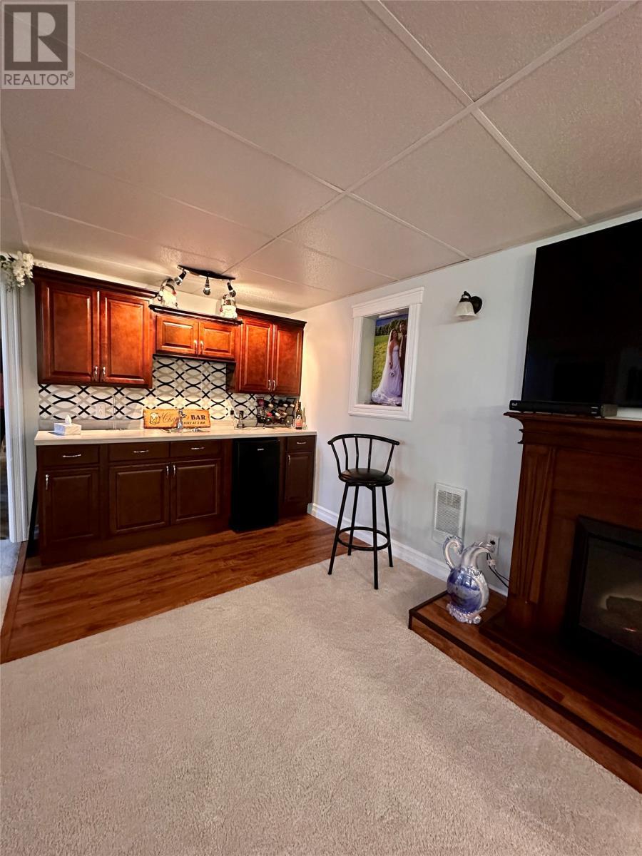 130 Main Road, Rushoon, NL - Indoor With Fireplace