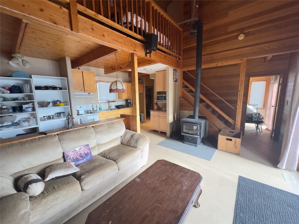 7902 Bell Rd. Road, Bridge Lake, BC - Indoor Photo Showing Living Room With Fireplace