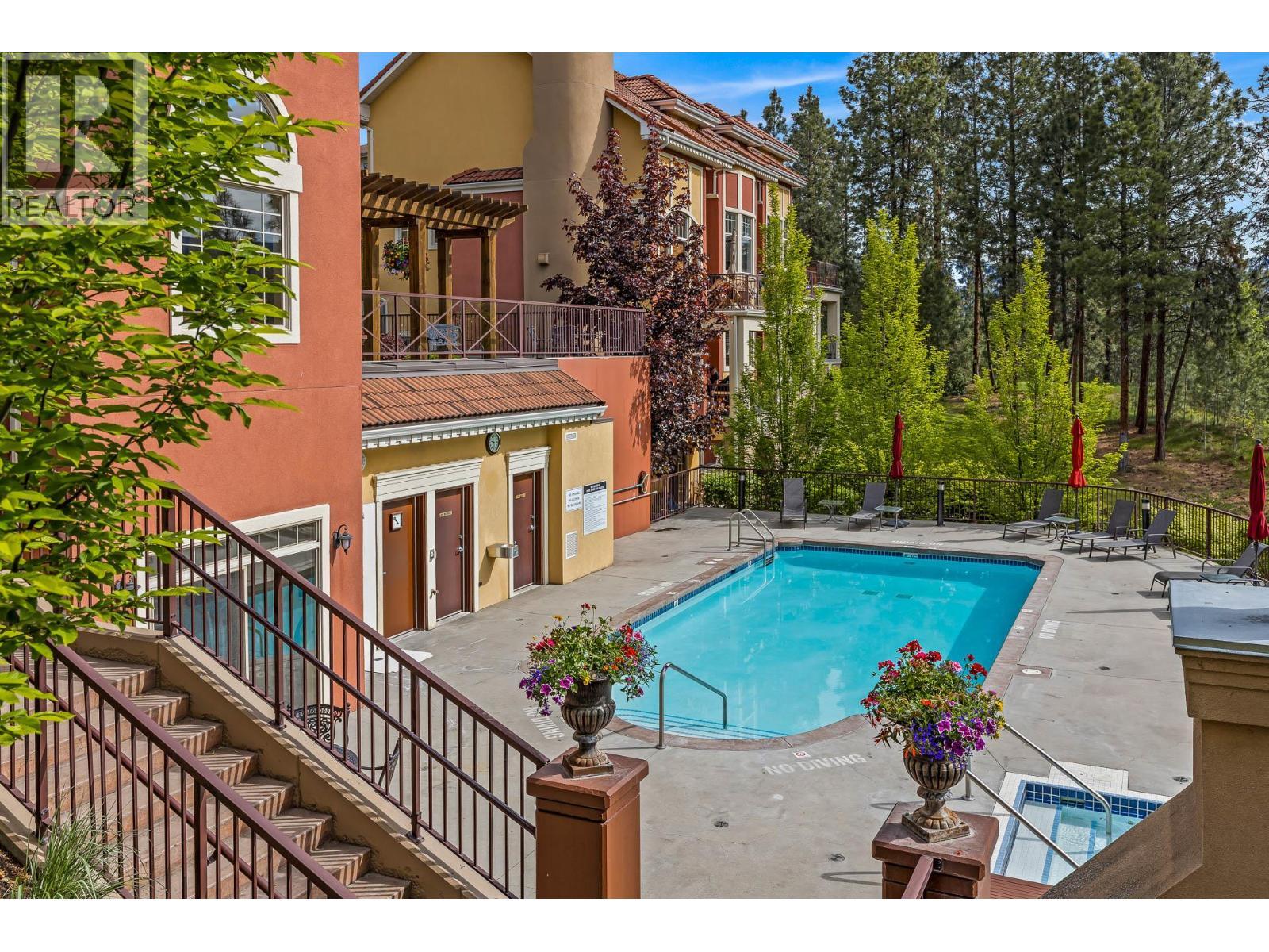 1795 Country Club Drive Unit# 201, Kelowna, BC - Outdoor With In Ground Pool