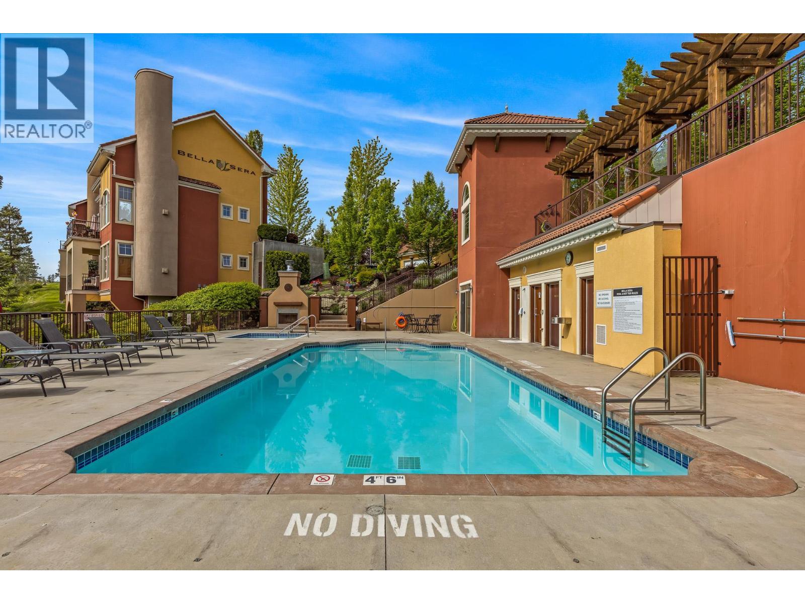1795 Country Club Drive Unit# 201, Kelowna, BC - Outdoor With In Ground Pool